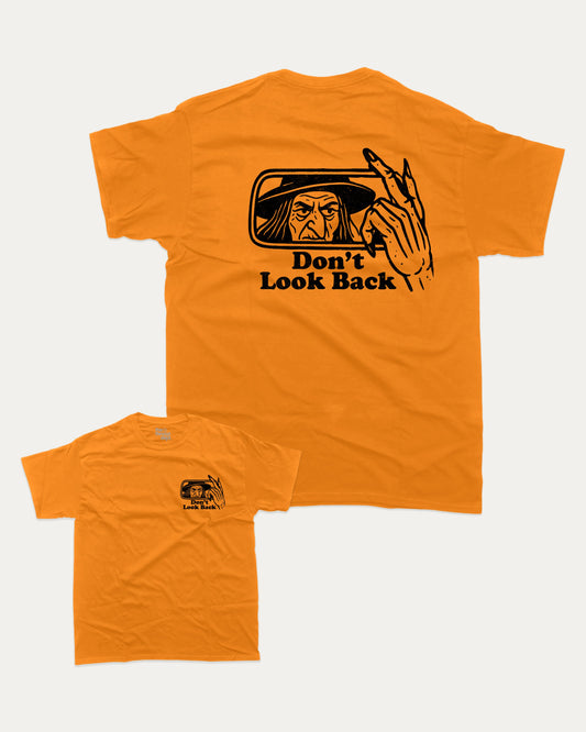 Don't Look Back graphic tee with bold and humorous print, funny and trendy graphic. Perfect gift for Halloween day, Halloween Graphic T shirt, Celebrating Halloween Tee,  Perfect for adults and gift-giving. Orange shirt.