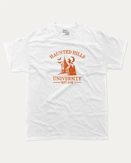 Haunted Hills University graphic tee with bold and humorous print, Halloween Graphic T shirt, Spooky T shirt, Perfect Gift for Halloween Day, funny and trendy graphic. Perfect for adults and gift-giving. White shirt.