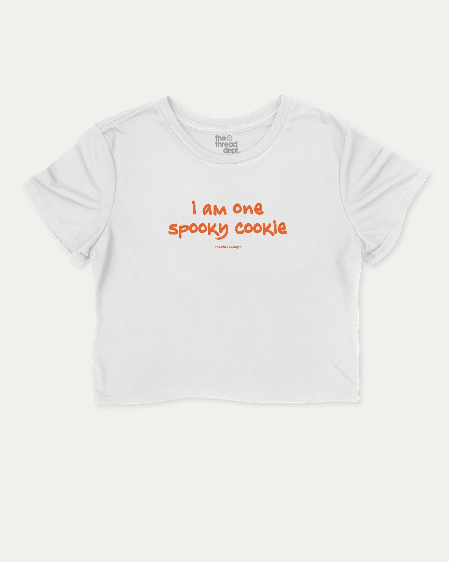 I am one spooky cookie graphic crop tee with funny and trendy slogan print, Halloween Graphic T shirt, Spooky T shirt, Perfect Gift for Halloween Day, perfect for women’s casual looks or layering. White crop t-shirt.