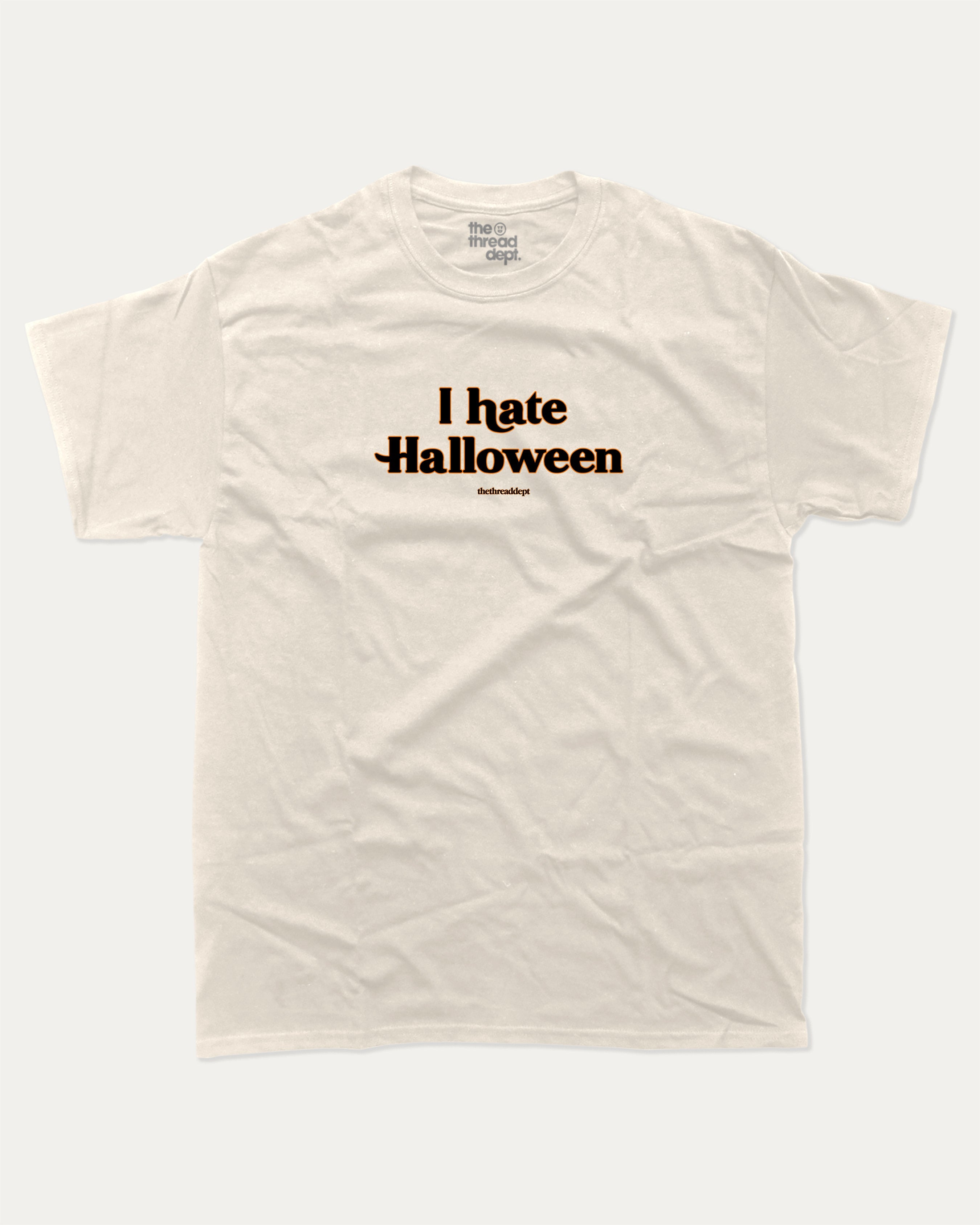 I Hate Halloween graphic t-shirt with bold and funny print, funny and trendy graphic. Perfect funny Halloween gifts for friends and family. Cream shirt.