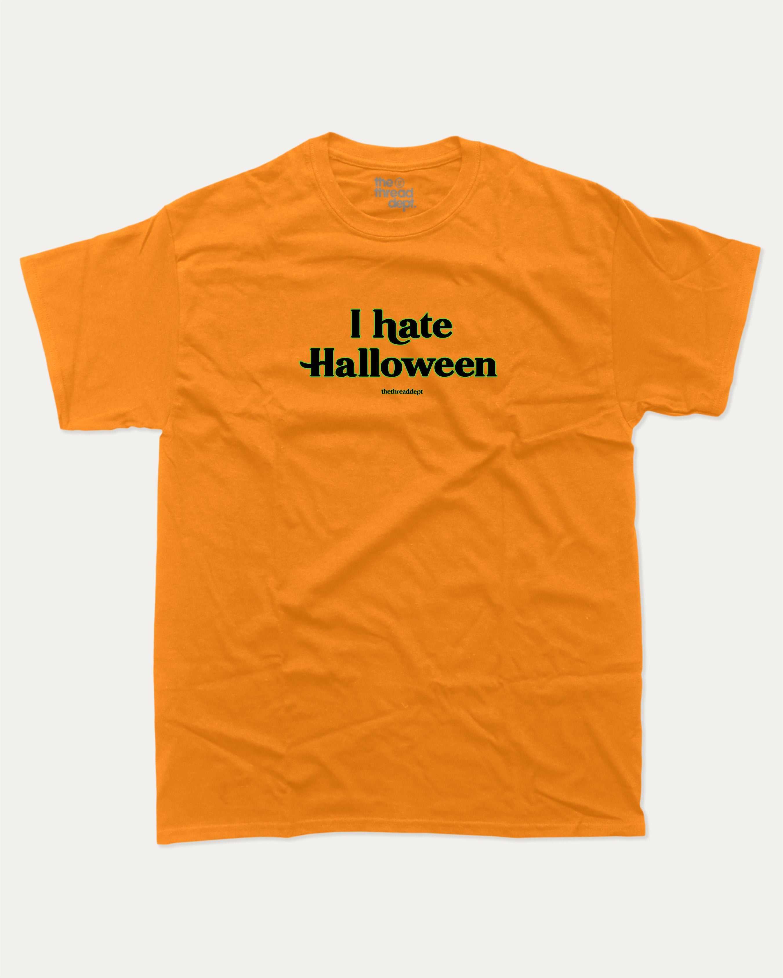 I Hate Halloween graphic t-shirt with bold and funny print, funny and trendy graphic. Perfect funny Halloween gifts for friends and family. Orange shirt.