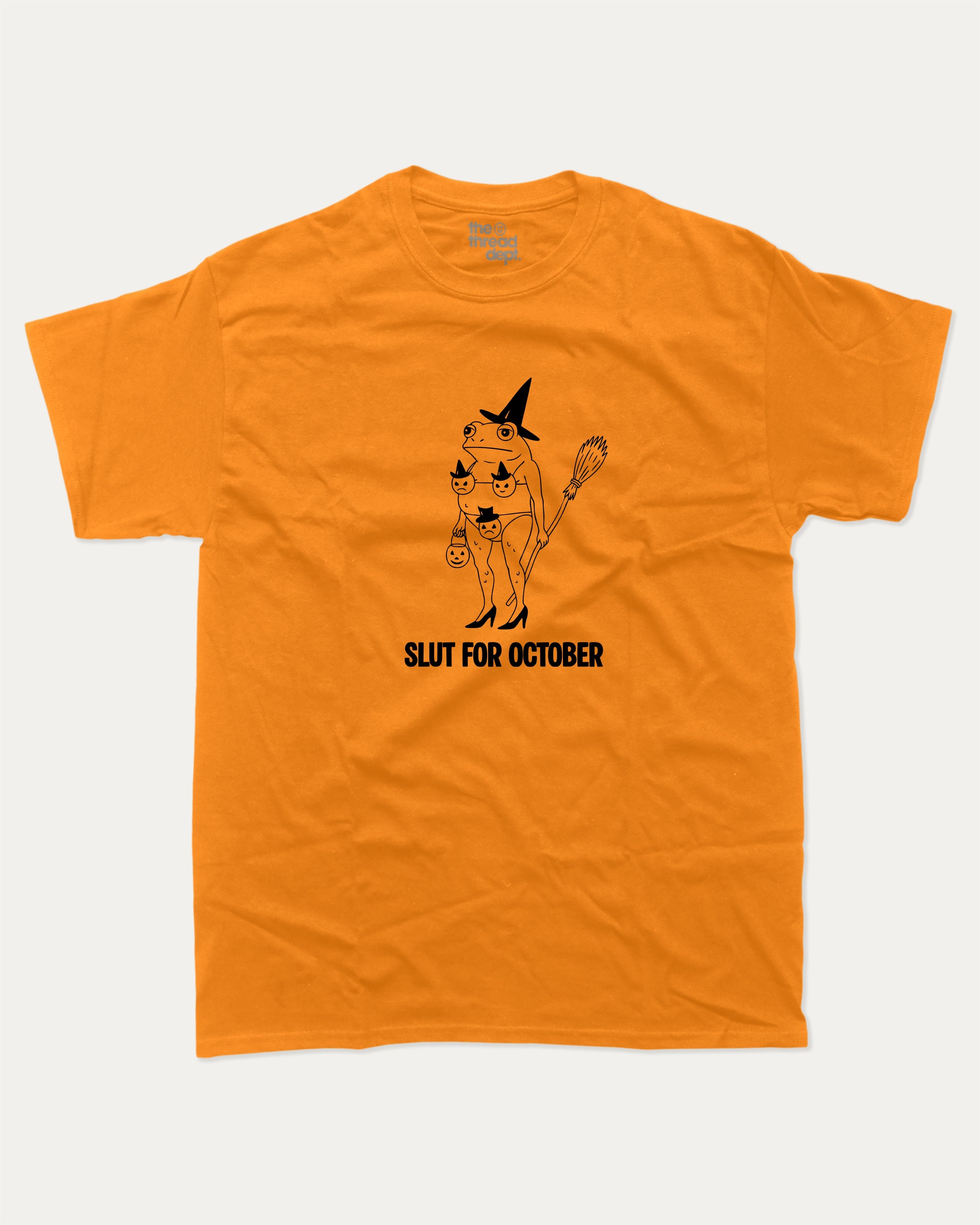 Slut for October graphic tee with bold and humorous print, Perfect Gift for Halloween Day, Halloween Graphic T shirt, Funny Halloween Graphic T shirt, funny and trendy graphic. Perfect for adults and gift-giving. Orange shirt.