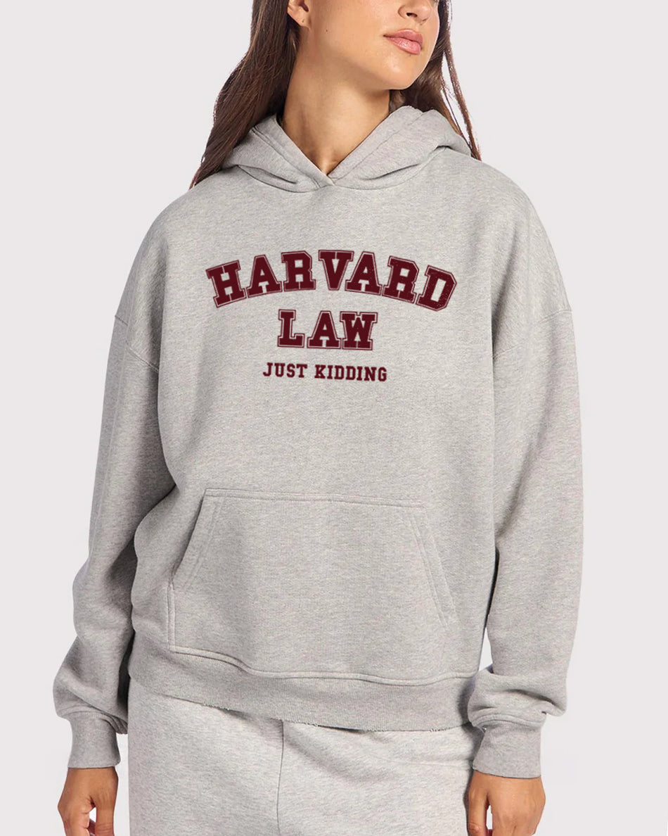Gray hoodie with 'Harvard Law Just Kidding' text on a white background