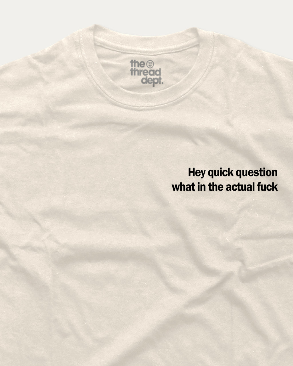 White t-shirt with black text 'Hey quick question what in the actual fuck' on a white background