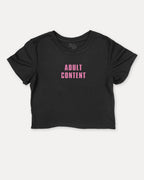 Adult Content graphic crop tee with funny and trendy slogan print, perfect for women’s casual looks or layering. Black crop t-shirt.