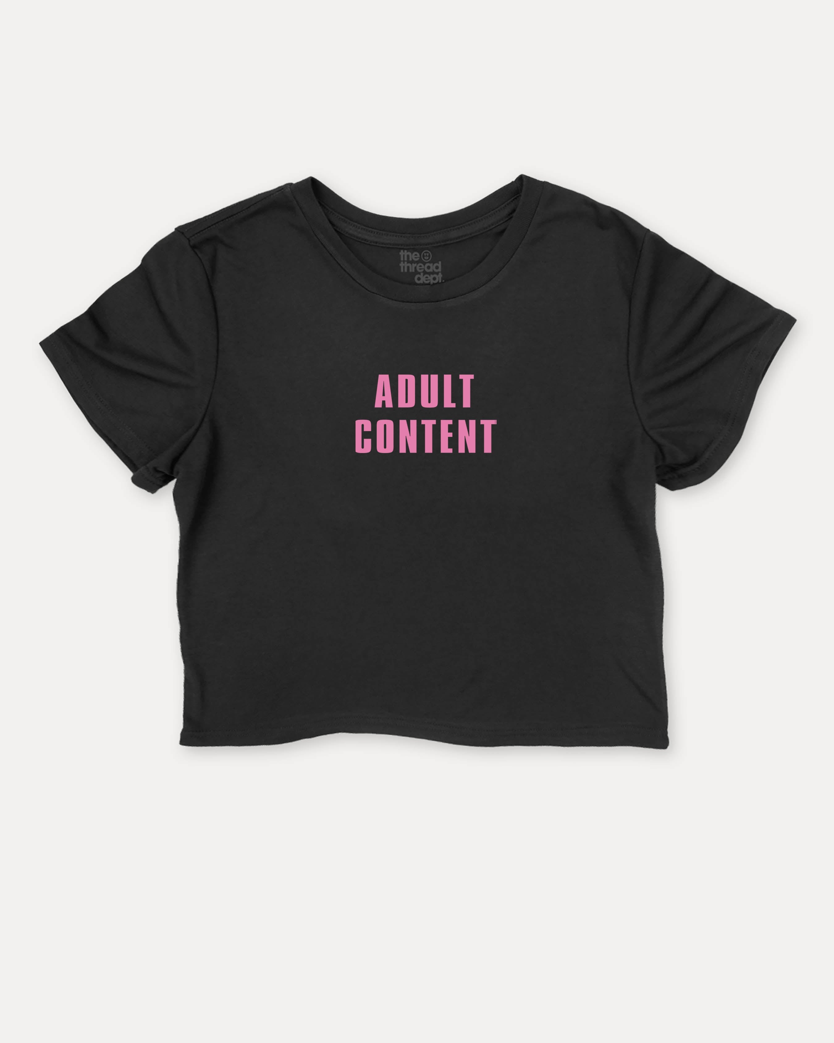 Adult Content graphic crop tee with funny and trendy slogan print, perfect for women’s casual looks or layering. Black crop t-shirt.