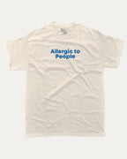 Allergic to People graphic tee with bold and humorous print, funny and trendy graphic. Perfect for adults and gift-giving. Cream shirt.