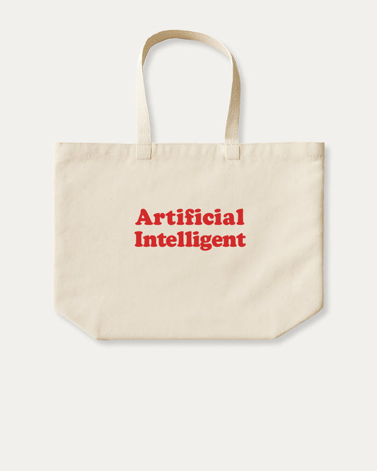 Beige tote bag with 'Artificial Intelligent' text in red on a white background
