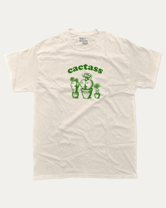 Cactass graphic tee with bold and humorous print, funny and trendy graphic. Perfect for adults and gift-giving. Cream shirt.