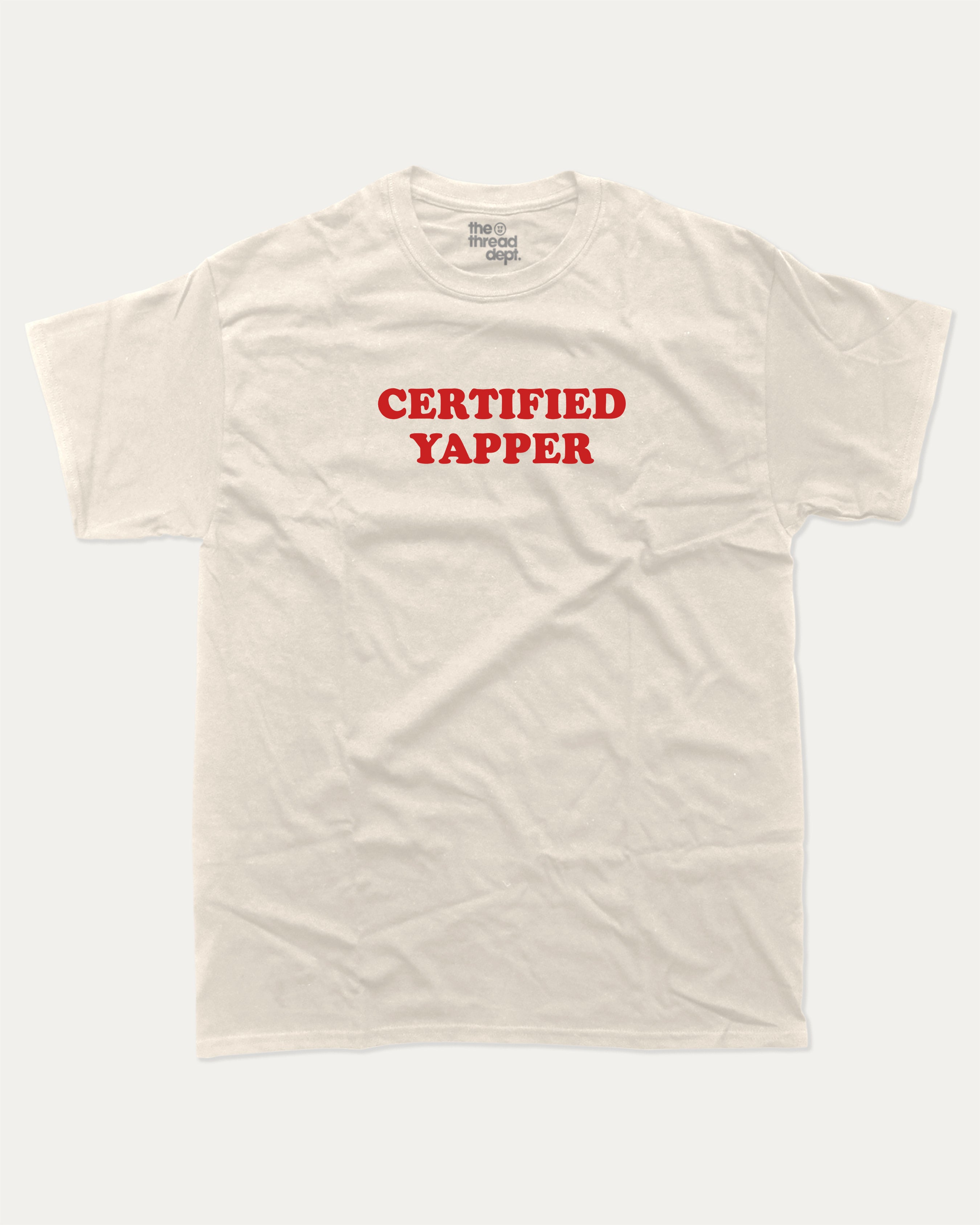 Certified Yapper graphic tee with bold and humorous print, funny and trendy meme graphic. Perfect for adults and gift-giving. Cream shirt.