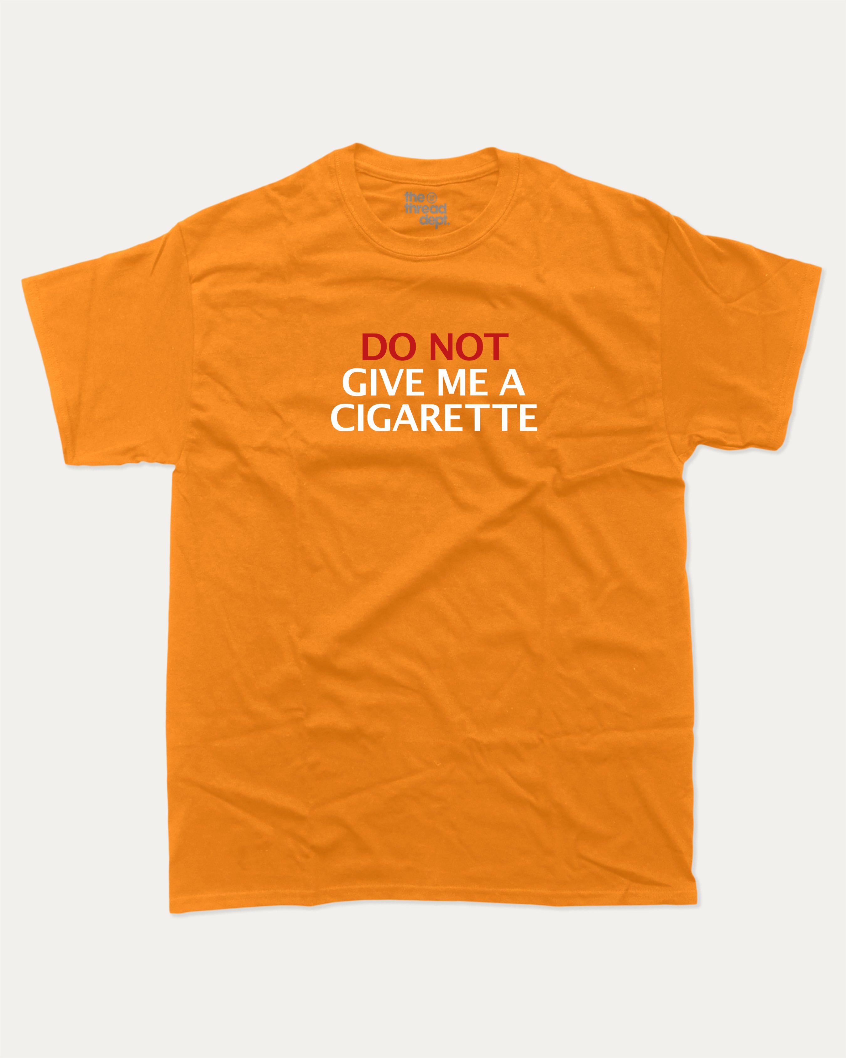 Do Not Give Me A Cigarette graphic tee with bold and humorous print, funny and trendy graphic. Perfect for adults and gift-giving. Orange shirt.