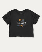 Everything I Want To Do Is Illegal graphic crop tee with funny and trendy slogan print, perfect for women’s casual looks or layering. Black crop t-shirt.