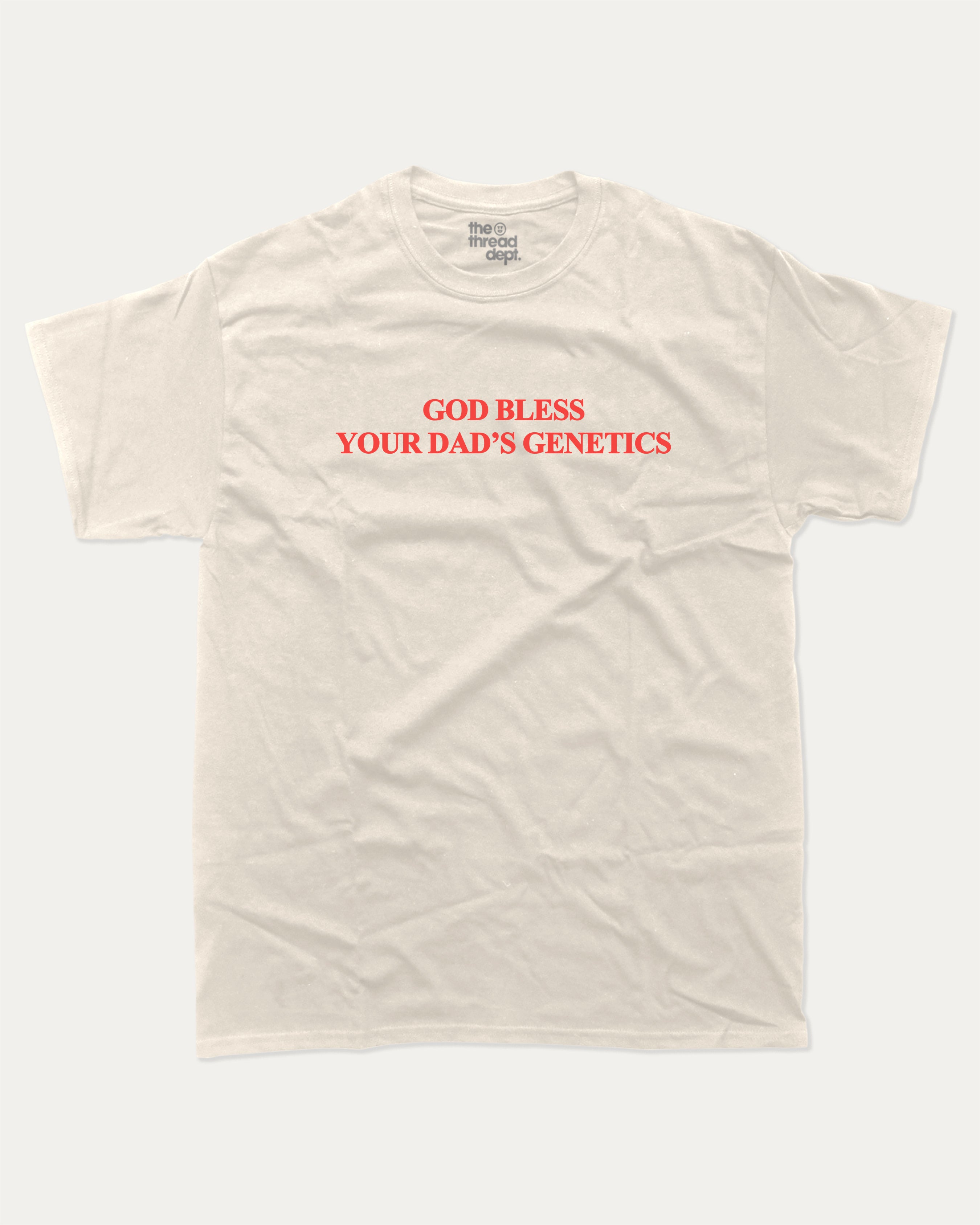 God bless your dad's genetics graphic tee with bold and humorous print, Funny Pun Graphic T shirt, Pun Graphic T shirt, funny and trendy graphic. Perfect for adults and gift-giving. Cream shirt.