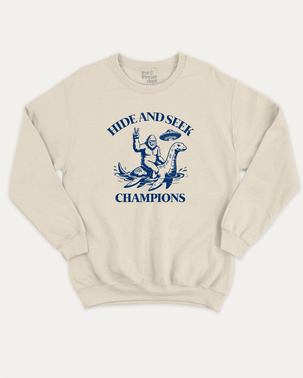 Hide and Seek Champions bigfoot graphic sweatshirt with bold and humorous print, warm and cozy graphic for everyday wear. Perfect funny gifts for friends and gift-giving. Natural pullover.