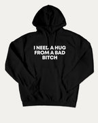 I need a hug from a bad bitch graphic hoodie with funny and trendy artwork, casual streetwear with bold personality. Great for adults and gifting. Black hoodie.