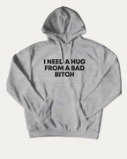 I need a hug from a bad bitch graphic hoodie with funny and trendy artwork, casual streetwear with bold personality. Great for adults and gifting. Heather Grey hoodie.