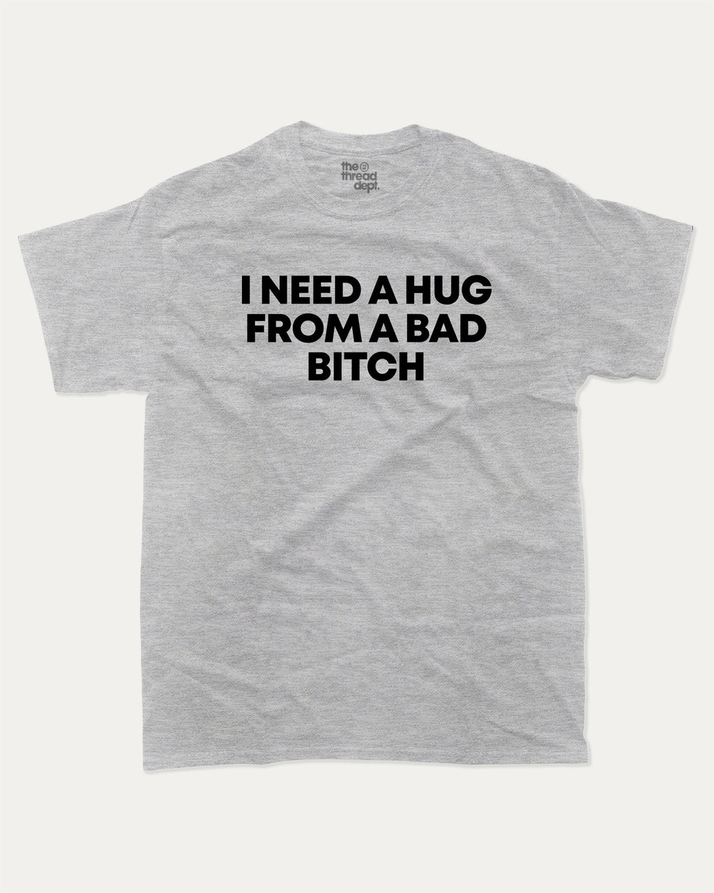 I need a hug from a bad bitch graphic tee with bold and humorous print, Funny meme graphic tee, funny and trendy graphic. Perfect for adults and gift-giving. Heather Grey shirt.