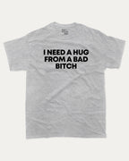 I need a hug from a bad bitch graphic tee with bold and humorous print, Funny meme graphic tee, funny and trendy graphic. Perfect for adults and gift-giving. Heather Grey shirt.