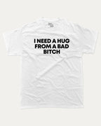I need a hug from a bad bitch graphic tee with bold and humorous print, Funny meme graphic tee, funny and trendy graphic. Perfect for adults and gift-giving. White shirt.