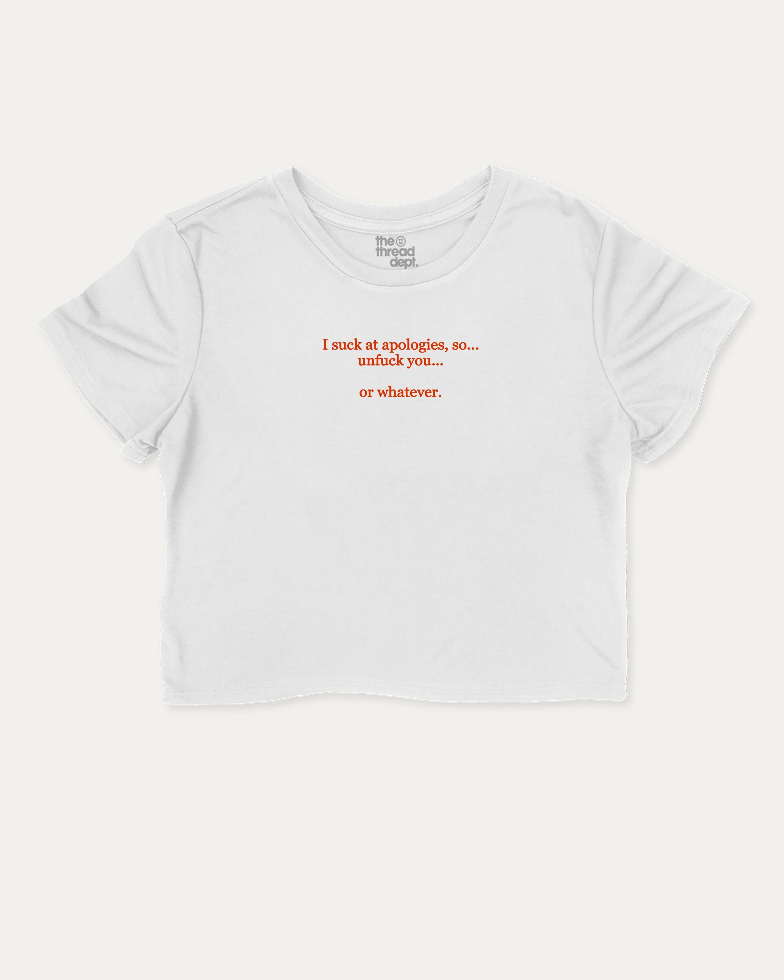 I suck at apologies graphic crop tee with funny and trendy slogan print, perfect for women_ casual looks or layering. White crop t-shirt.