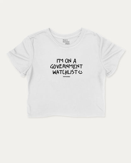I'm on a government watchlist graphic crop tee with funny and trendy slogan print, perfect for women’s casual looks or layering. White crop t-shirt.