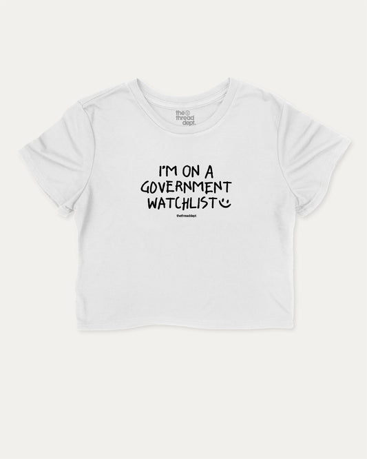 I'm on a government watchlist graphic crop tee with funny and trendy slogan print, perfect for women’s casual looks or layering. White crop t-shirt.