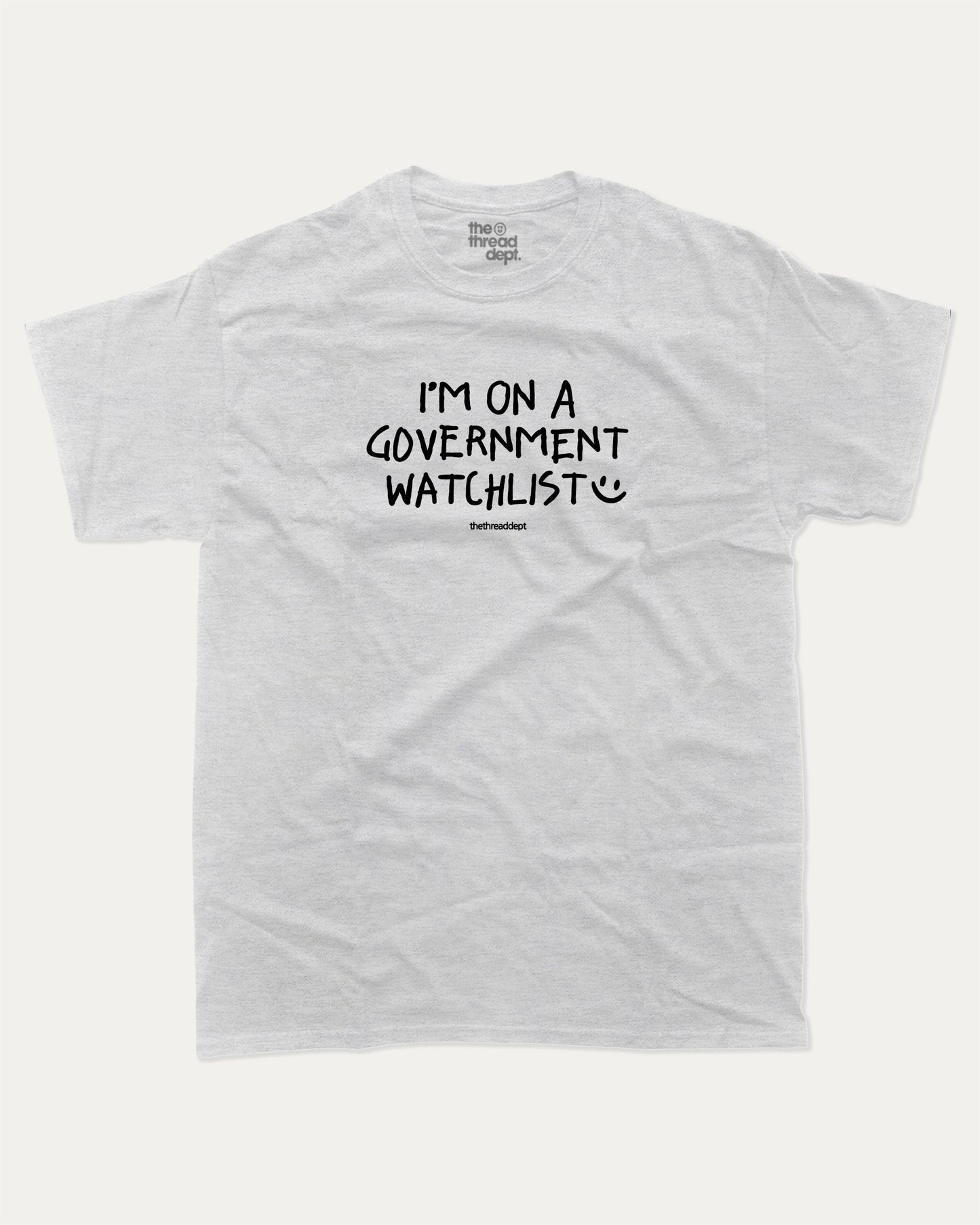 I'm on a government watchlist graphic tee with bold and humorous print, funny and trendy graphic. Perfect for adults and gift-giving. Ash Grey shirt.