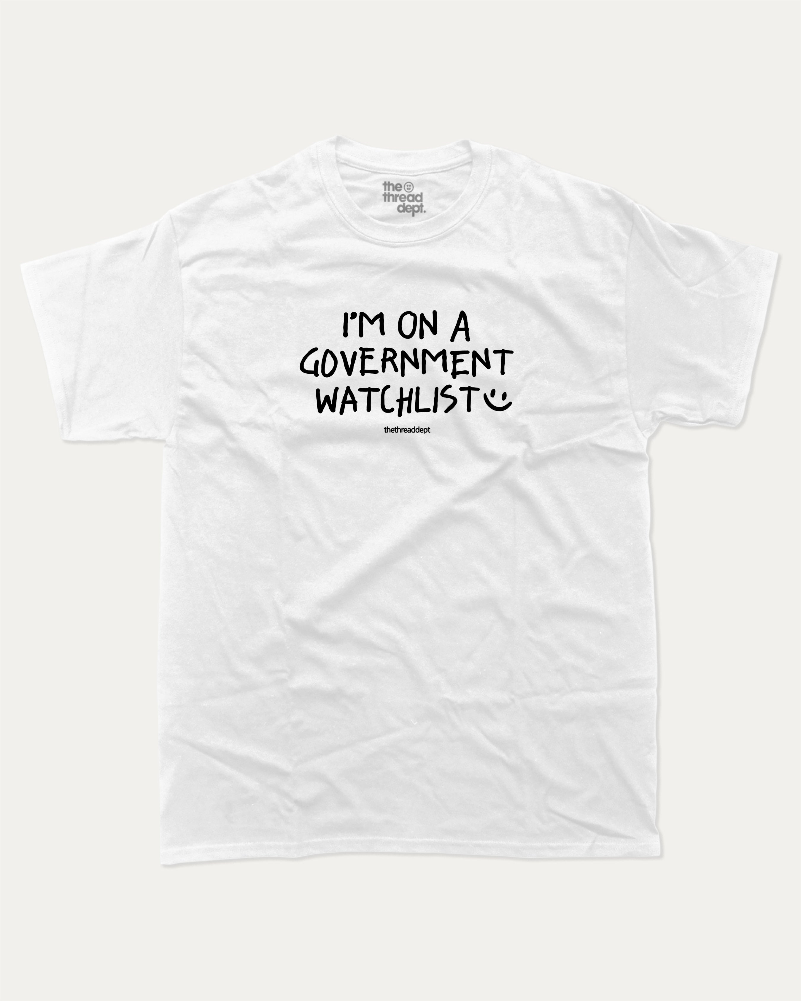 I'm on a government watchlist graphic tee with bold and humorous print, funny and trendy graphic. Perfect for adults and gift-giving. White shirt.