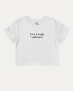Live Laugh Leftovers graphic crop tee with funny and trendy saying print, perfect for women_ casual looks or layering. White crop t-shirt.