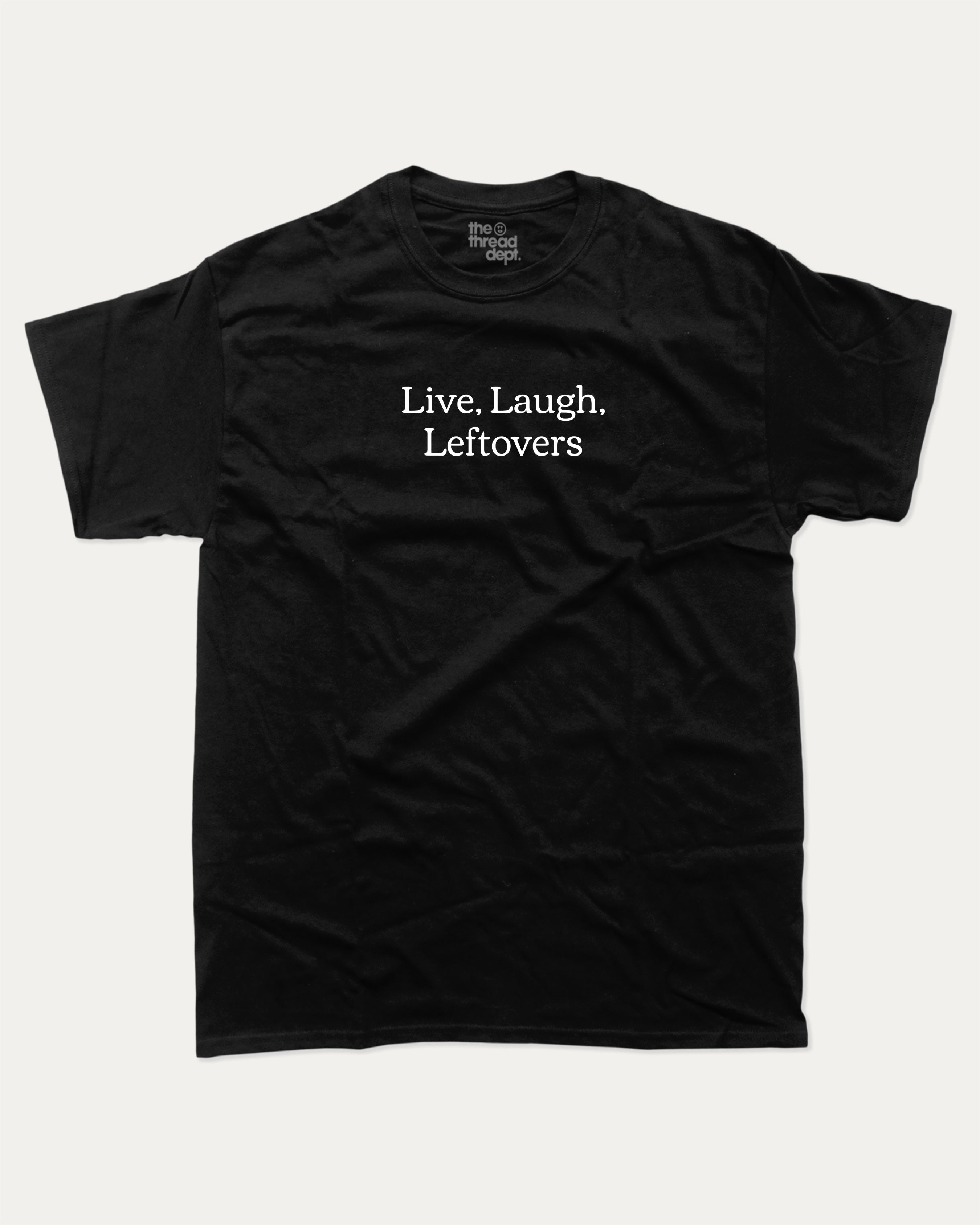 Live Laugh Leftovers graphic tee with bold and humorous saying print, funny and trendy graphic. Perfect for adults and gift-giving. Black shirt.