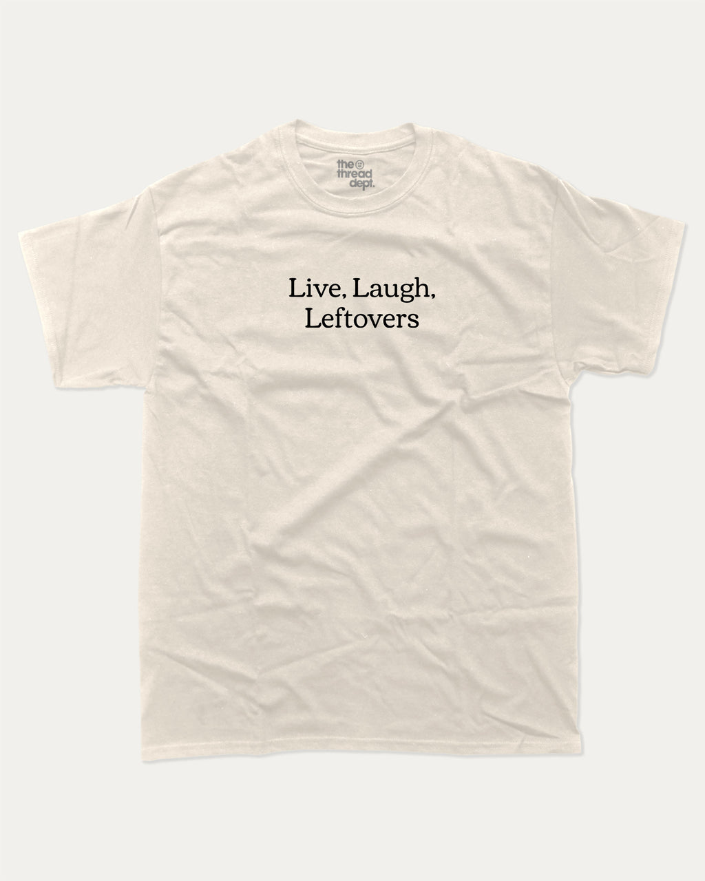 Live Laugh Leftovers graphic tee with bold and humorous saying print, funny and trendy graphic. Perfect for adults and gift-giving. Cream shirt.
