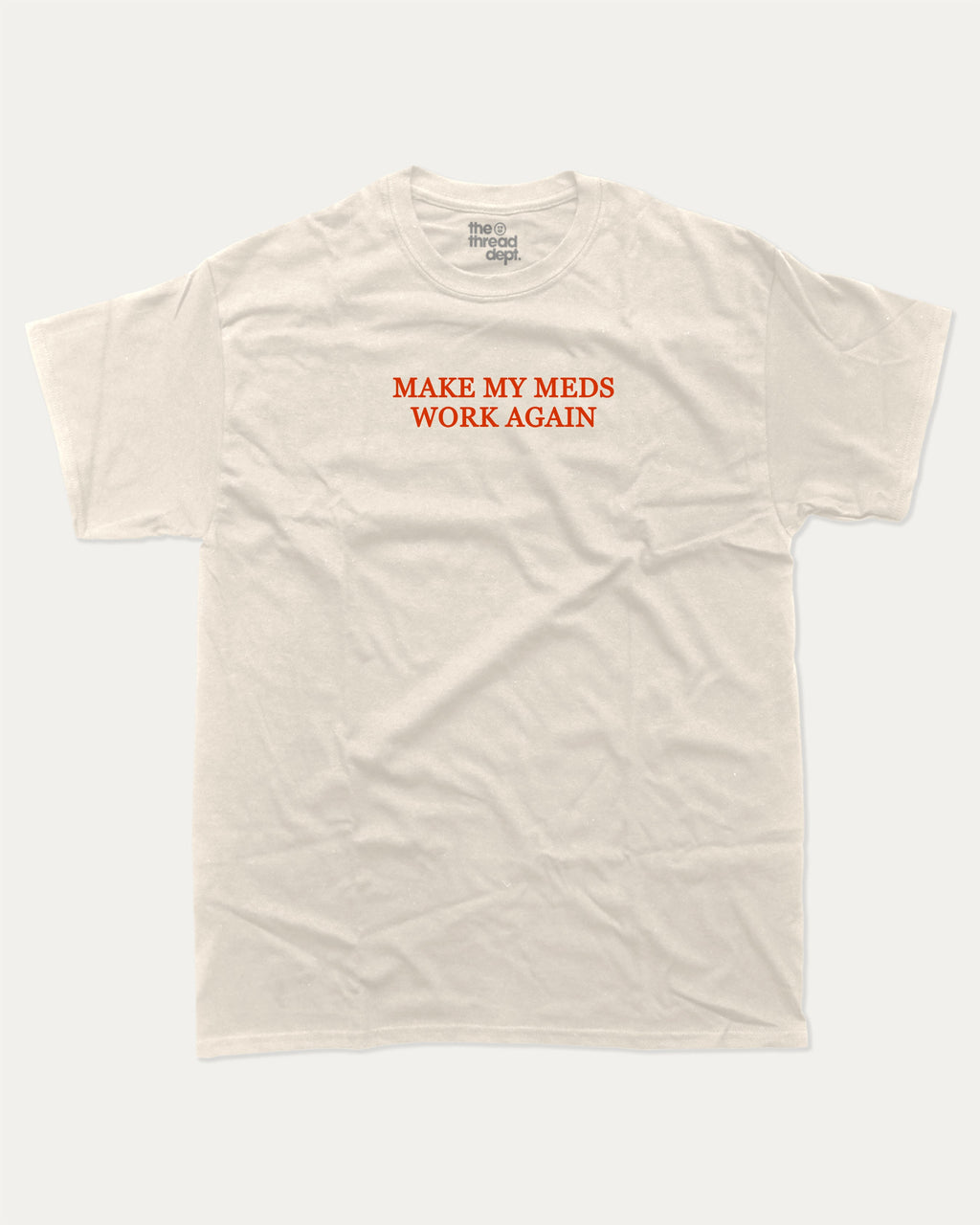 Make my meds work again graphic tee with bold and humorous print, Pun Graphic T shirt, Pun words tee, Funny Pun Graphic tees, funny and trendy graphic. Perfect for adults and gift-giving. Cream shirt.