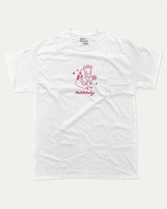 Mooody Cow graphic t-shirt, perfect for adults. Vintage and cute graphic tee, trending meme shirt, unique gift idea. White.