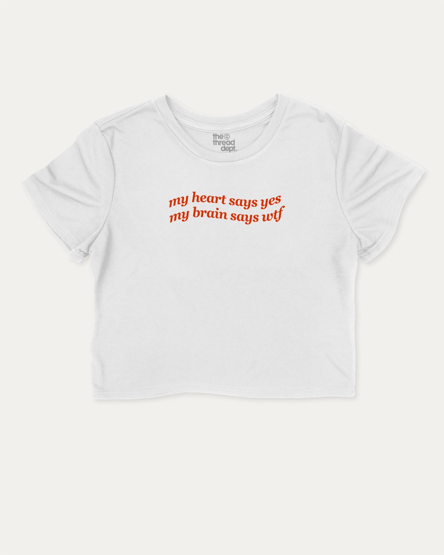 my heart says yes my brain says wtf graphic crop tee with funny and trendy slogan print, perfect for women’s casual looks or layering. White crop t-shirt.