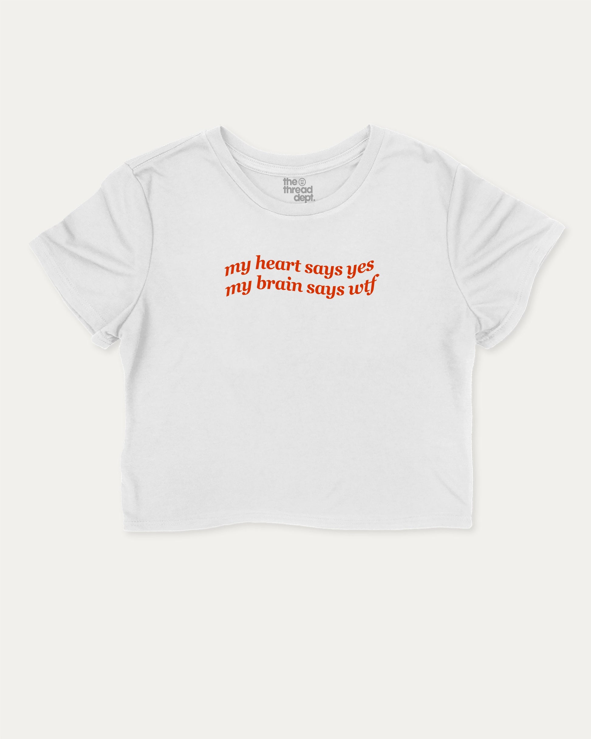 my heart says yes my brain says wtf graphic crop tee with funny and trendy slogan print, perfect for women’s casual looks or layering. White crop t-shirt.