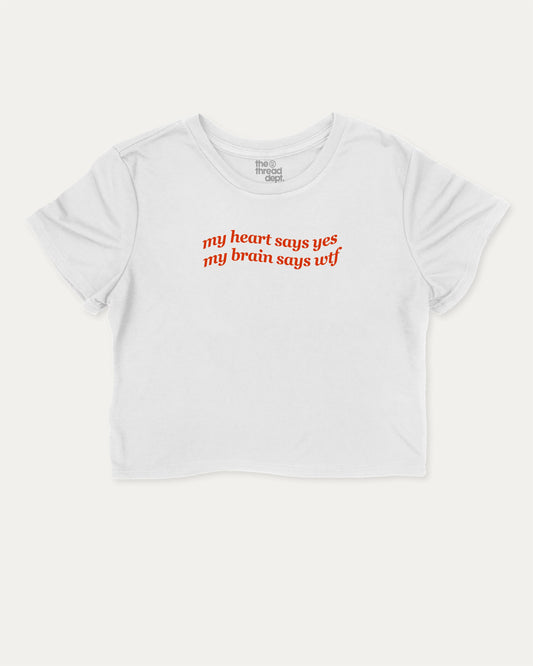 my heart says yes my brain says wtf graphic crop tee with funny and trendy slogan print, perfect for women’s casual looks or layering. White crop t-shirt.