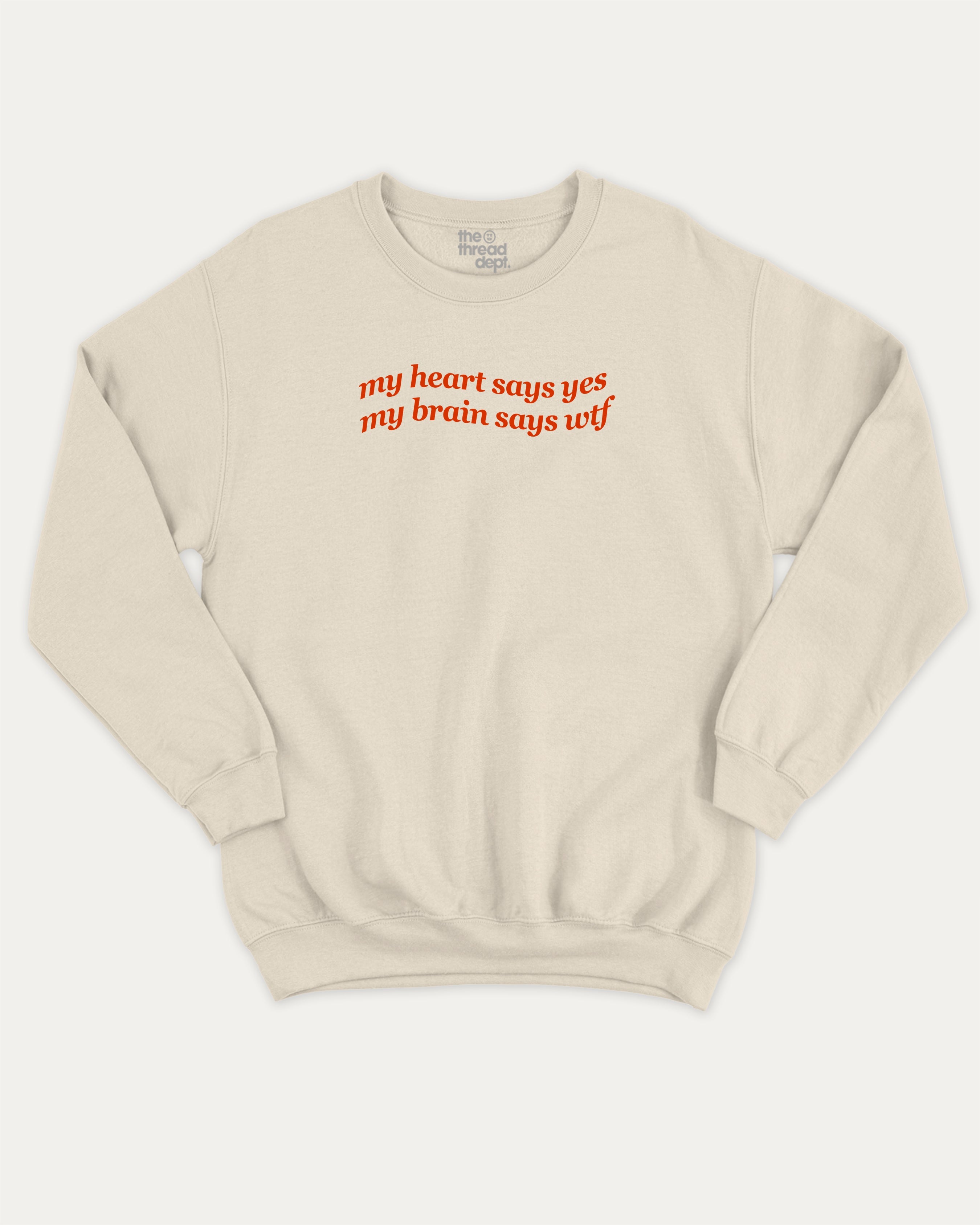 my heart says yes my brain says wtf graphic sweatshirt with bold and humorous print, warm and cozy graphic for everyday wear. Perfect for adults and gift-giving. Natural pullover.