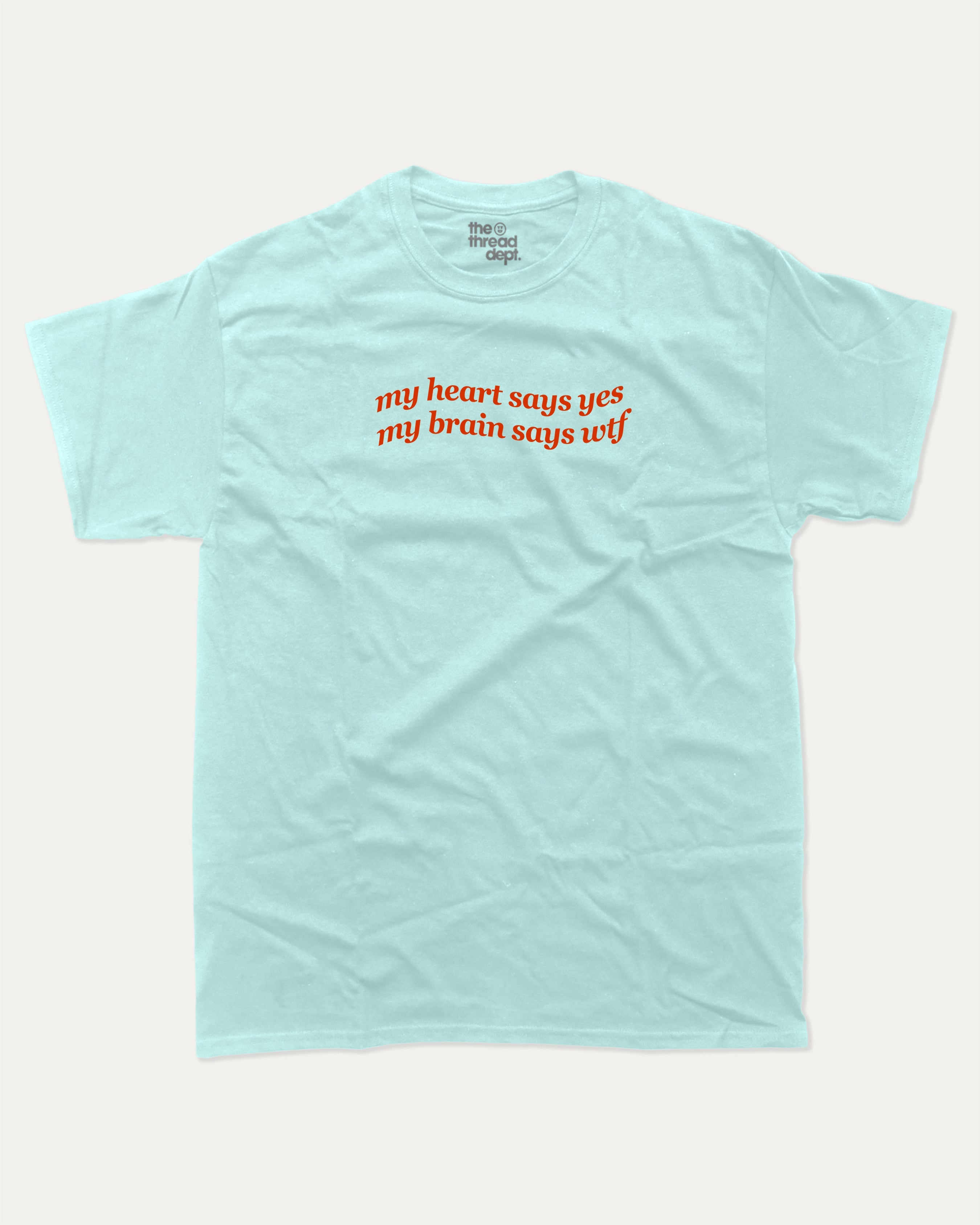 my heart says yes my brain says wtf graphic tee with bold and humorous print, funny and trendy graphic. Perfect for adults and gift-giving. Celadon shirt.