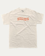 my heart says yes my brain says wtf graphic tee with bold and humorous print, funny and trendy graphic. Perfect for adults and gift-giving. Cream shirt.
