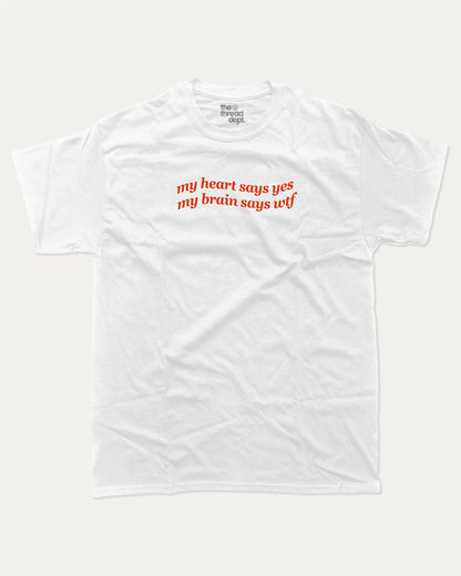 my heart says yes my brain says wtf graphic tee with bold and humorous print, funny and trendy graphic. Perfect for adults and gift-giving. White shirt.