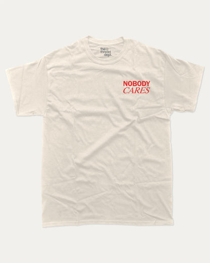 Nobdy Cares graphic t-shirt, perfect for adults. A must-have funny tee, Funny Graphic Tee. Humorous Text T shirt, Trending meme shirt,, unique gift idea. Cream.