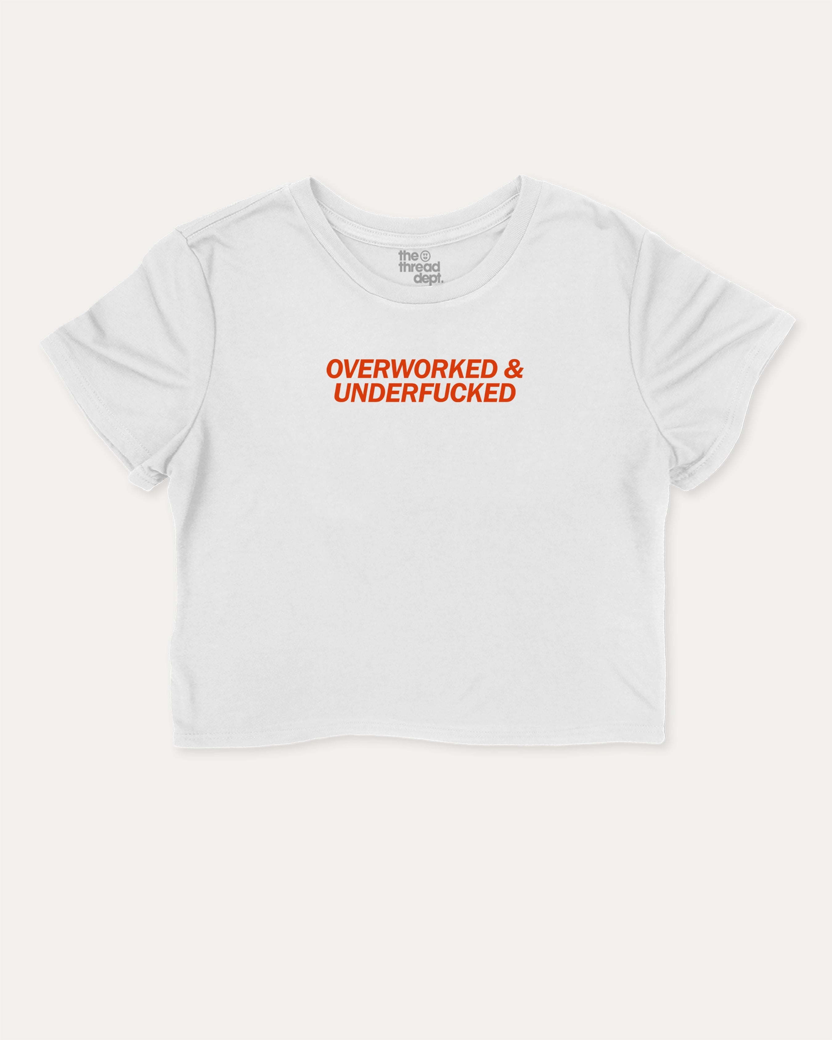 Overworked and Underfucked graphic crop tee with funny and trendy slogan print, perfect for women_ casual looks or layering. White crop t-shirt.