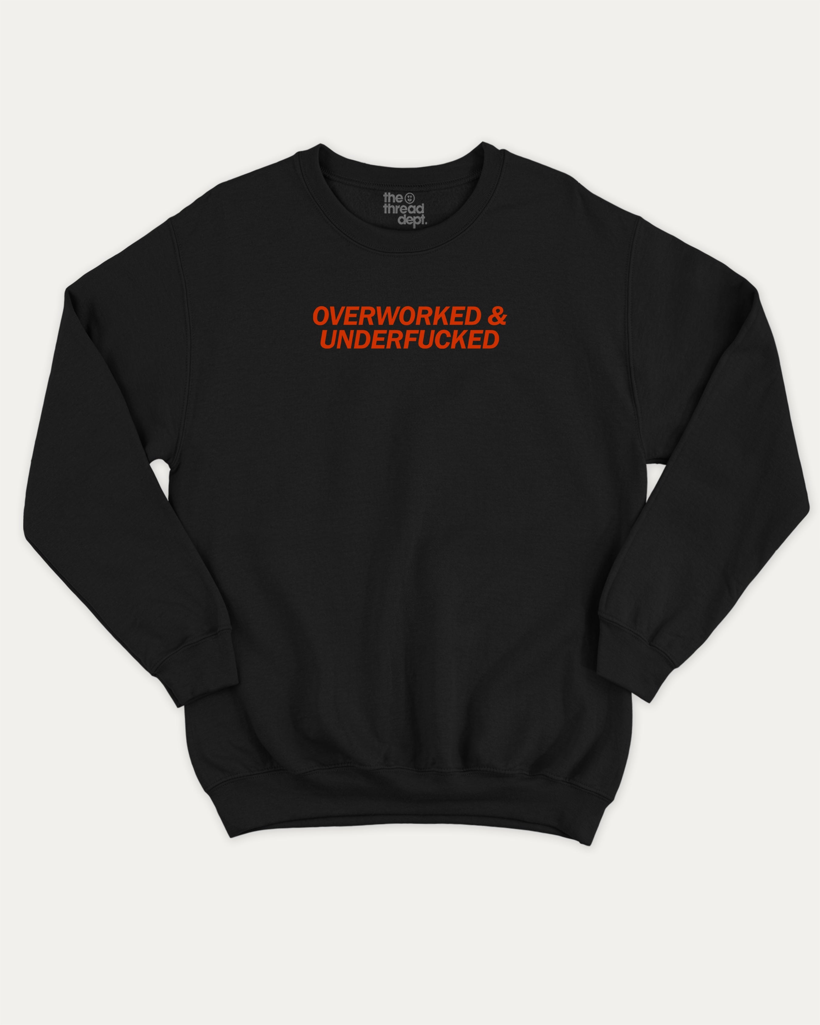 Overworked and Underfucked graphic sweatshirt with bold and humorous print, warm and cozy graphic for everyday wear. Perfect for adults and gift-giving. Black pullover.