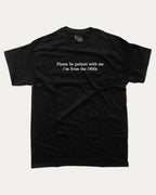 Please Be Patient With Me I'm From The 1900s graphic tee with retro and humorous print, funny and trendy graphic. Perfect for adults and gift-giving. Black shirt.