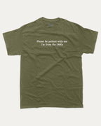 Please Be Patient With Me I'm From The 1900s graphic tee with retro and humorous print, funny and trendy graphic. Perfect for adults and gift-giving. Military Green shirt.
