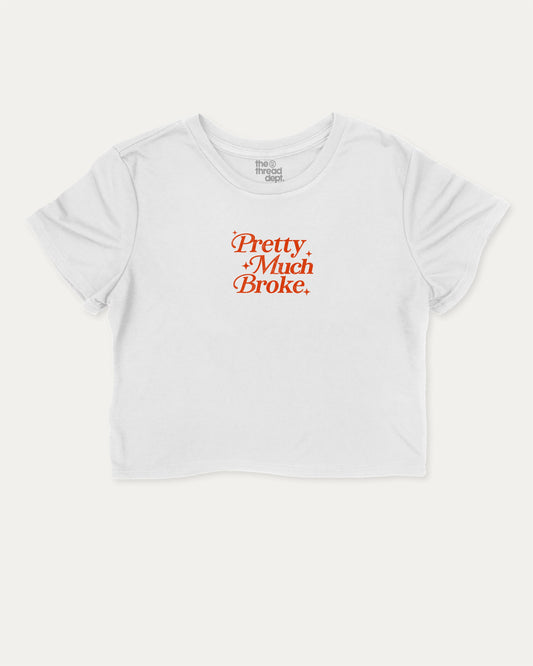 Pretty Much Broke graphic crop tee with funny and trendy slogan print, perfect for women’s casual looks or layering. White crop t-shirt.