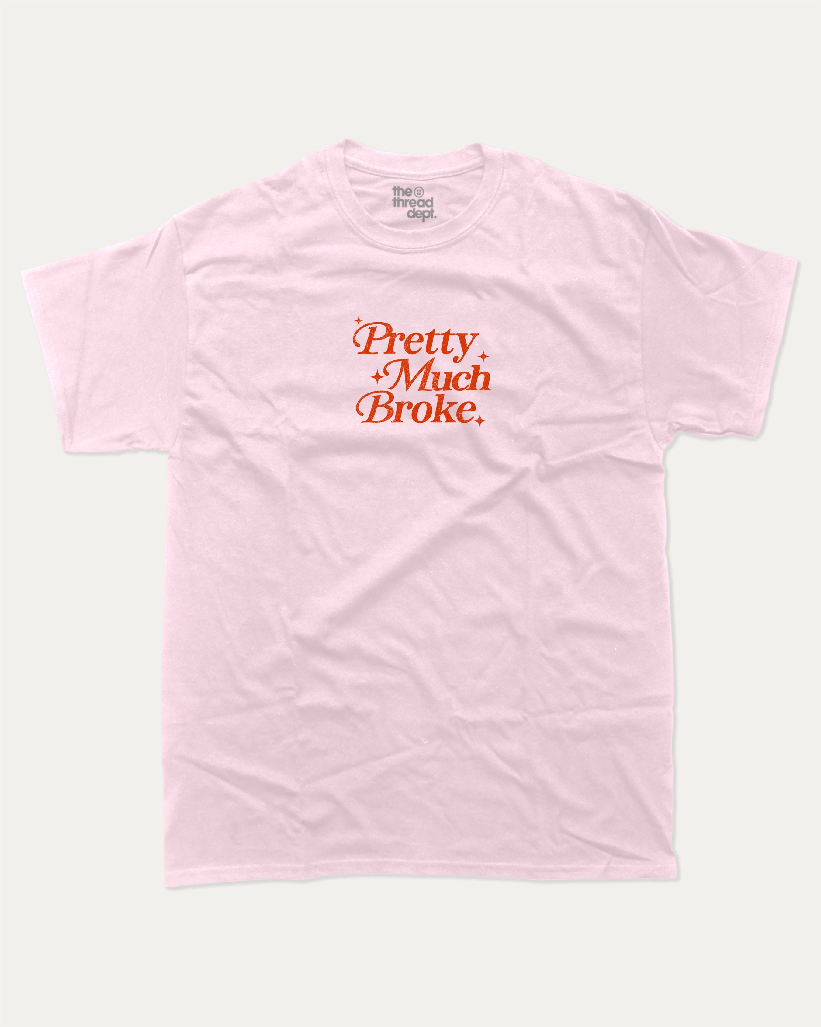Pretty Much Broke graphic tee with bold and humorous print, funny and trendy graphic. Perfect for adults and gift-giving. Pink shirt.