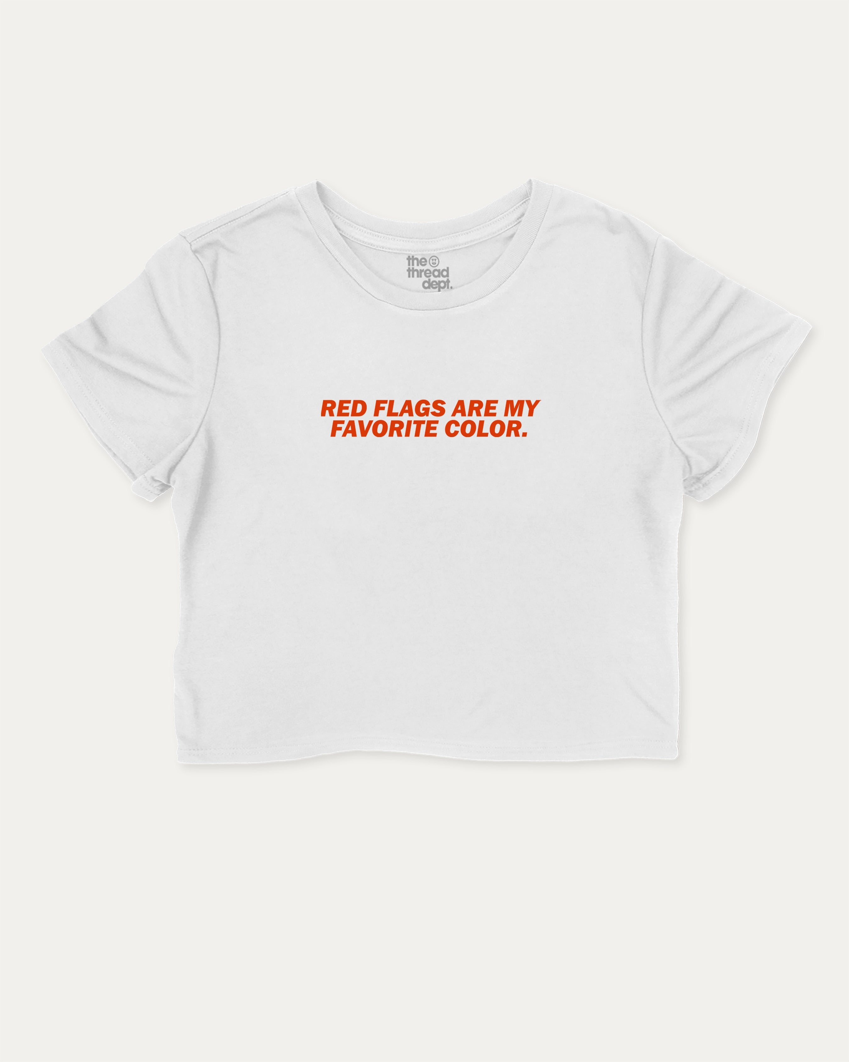 Red Flags Are My Favorite Color graphic crop tee with funny and trendy slogan print, perfect for women’s casual looks or layering. White crop t-shirt.