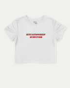 Situationship Survivor graphic crop tee with funny and trendy slogan print, perfect for women’s casual looks or layering. White crop t-shirt.