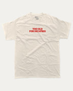 Too Old For Dicaprio graphic tee with bold and humorous print, funny and trendy graphic. Perfect for adults and gift-giving. Cream shirt.